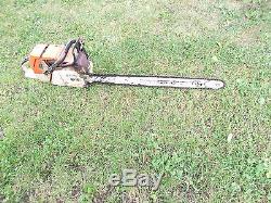 STIHL 084 CHAINSAW with 33 INCH BAR and 9 NEW CHAINS. 404 PITCH CHISEL TOOTH